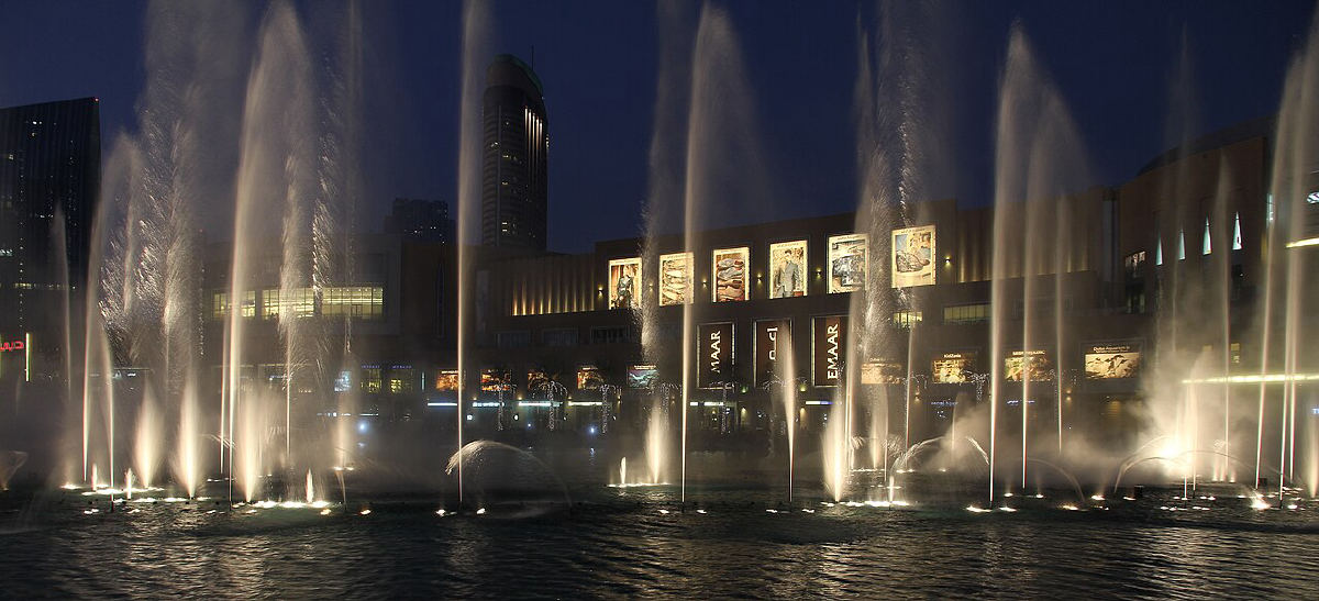 The Dubai Fountain show at dusk below the Burj Khalifa