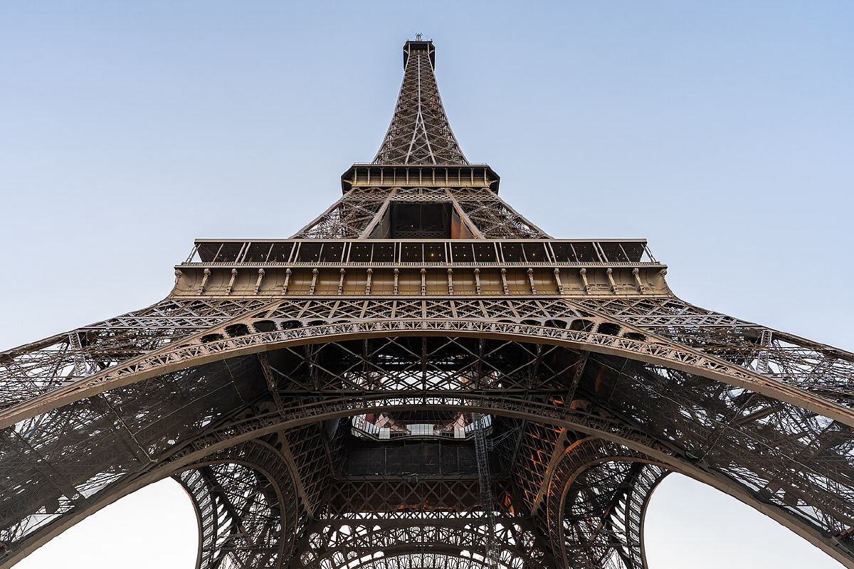 The Eiffel Tower against a blue sky